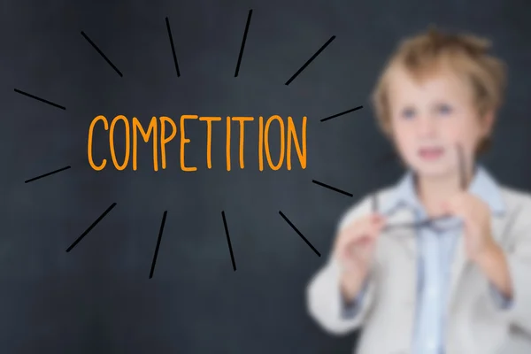 Competition against schoolboy and blackboard — Stock Photo, Image