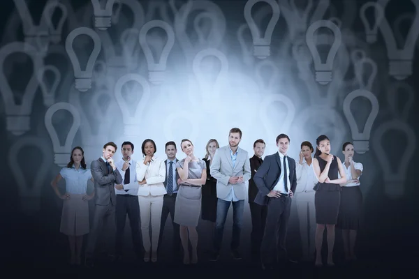 Business team against light bulb — Stock Photo, Image