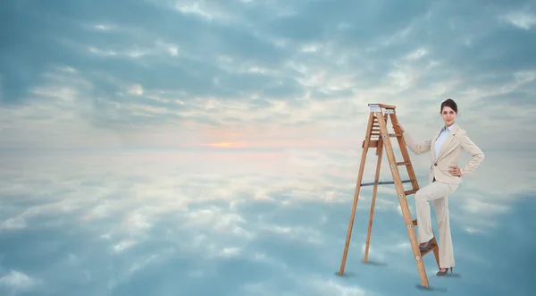 Businesswoman climbing the career ladder — Stock Photo, Image