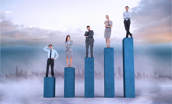 Business people on bar chart — Stock Photo, Image