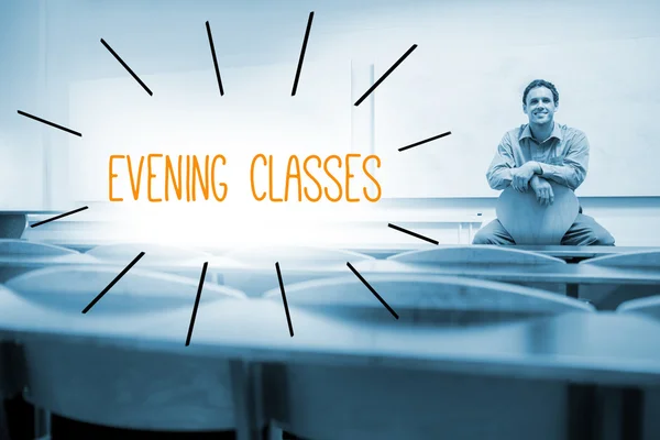 Evening classes against lecturer sitting in lecture hall — Stock Photo, Image