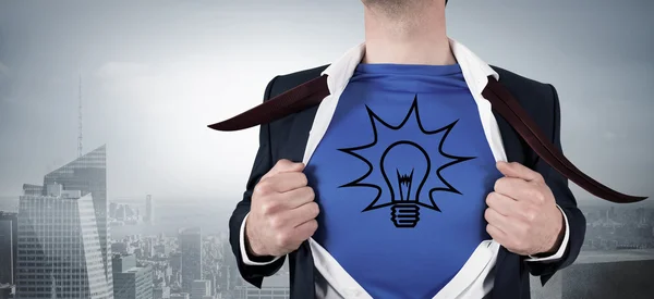 Businessman opening his shirt superhero style — Stock Photo, Image