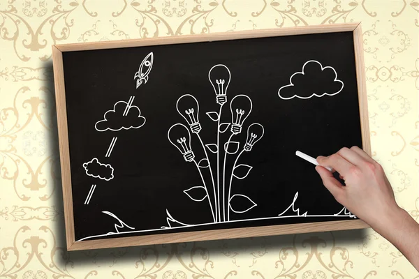 Hand drawing light bulb plant with chalk — Stock Photo, Image