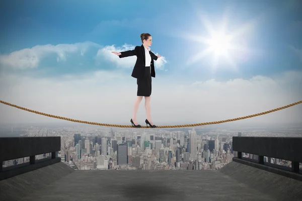 Businesswoman performing a balancing act — Stock Photo, Image