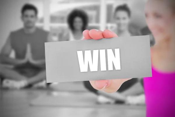 Fit blonde holding card saying win — Stock Photo, Image
