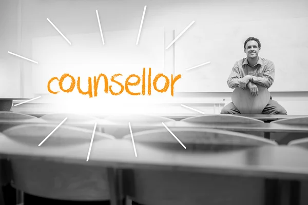 Counsellor against lecturer sitting in lecture hall — Stock Photo, Image