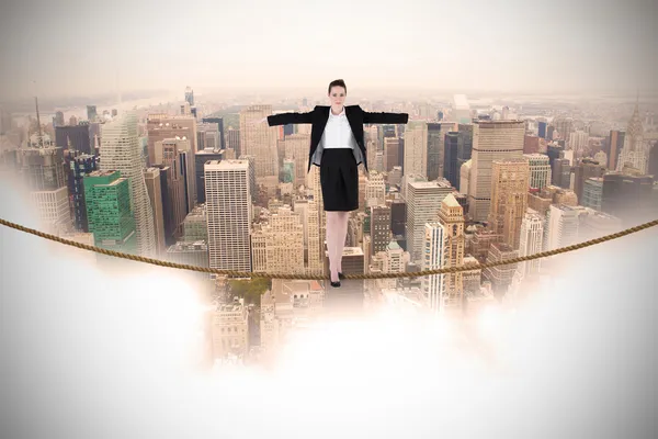 Businesswoman performing a balancing act — Stock Photo, Image