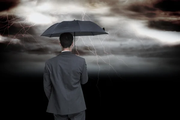 Classy businessman holding umbrella — Stock Photo, Image