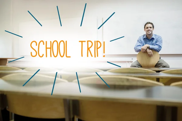 School trip! against lecturer sitting in lecture hall — Stock Photo, Image