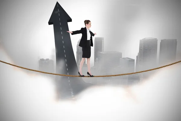 Businesswoman performing a balancing act — Stock Photo, Image