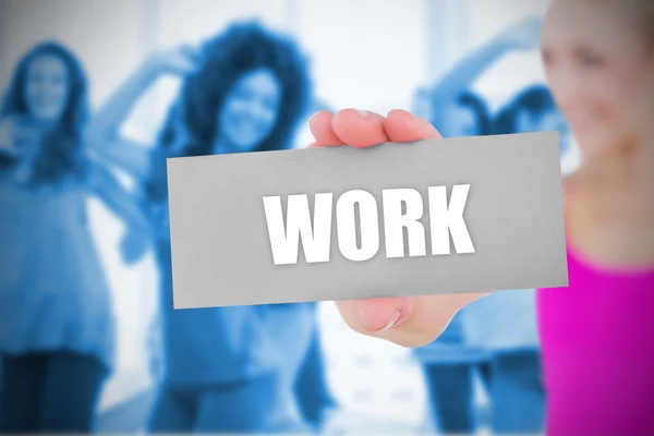 Fit blonde holding card saying work — Stock Photo, Image