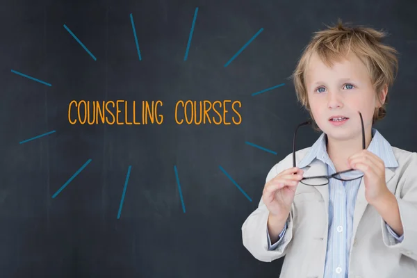 Counselling courses against schoolboy and blackboard — Stock Photo, Image