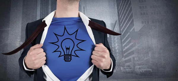 Businessman opening his shirt superhero style — Stock Photo, Image