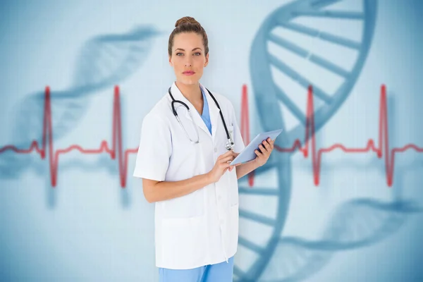 Pretty nurse using tablet pc — Stock Photo, Image