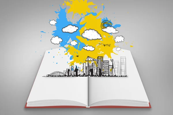 Paint splashes on open book — Stock Photo, Image