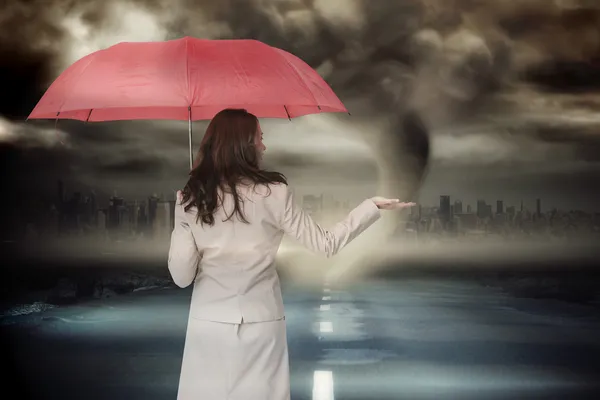 Businesswoman holding umbrella — Stock Photo, Image