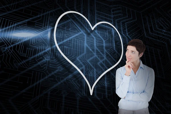 Heart and thinking businesswoman — Stock Photo, Image