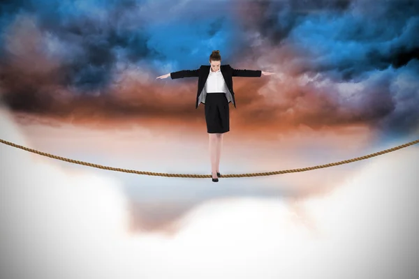 Businesswoman performing a balancing act — Stock Photo, Image