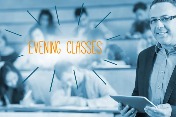 Evening classes against lecturer standing in front of his class in lecture hall — Stock Photo, Image