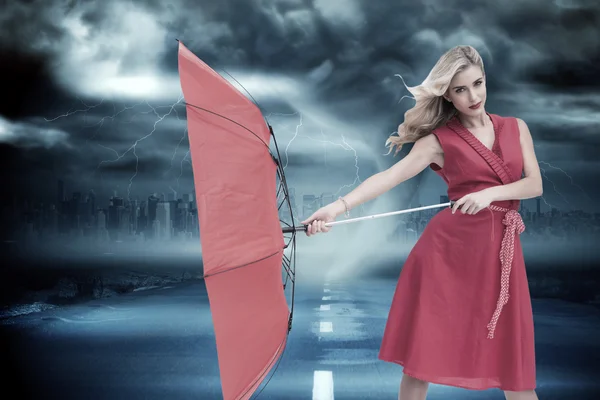 Elegant blonde holding umbrella — Stock Photo, Image