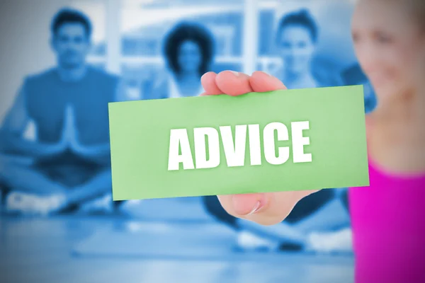 Fit blonde holding card saying advice — Stock Photo, Image