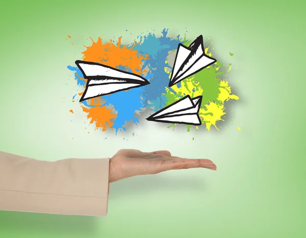 Hand presenting paper airplanes — Stock Photo, Image