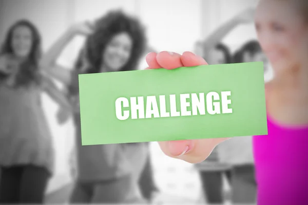 Fit blonde holding card saying challenge — Stock Photo, Image