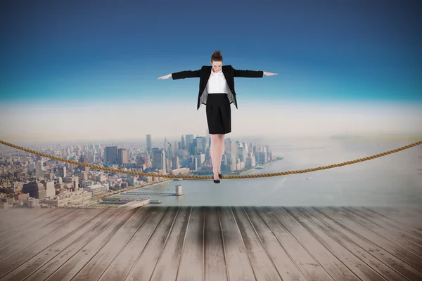 Businesswoman performing a balancing act — Stock Photo, Image