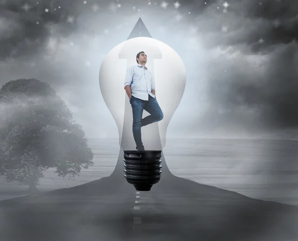 Thinking man in light bulb — Stock Photo, Image