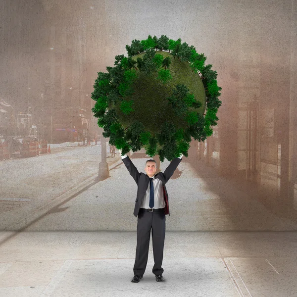 Businessman holding green sphere — Stock Photo, Image