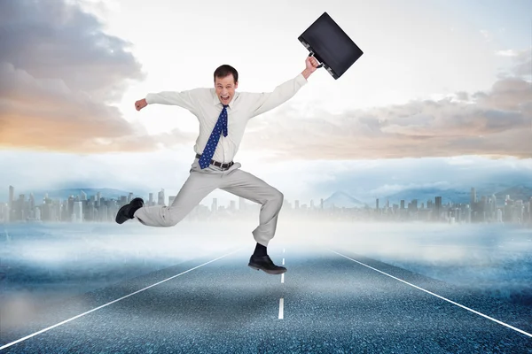 Jumping businessman with his suitcase — Stock Photo, Image