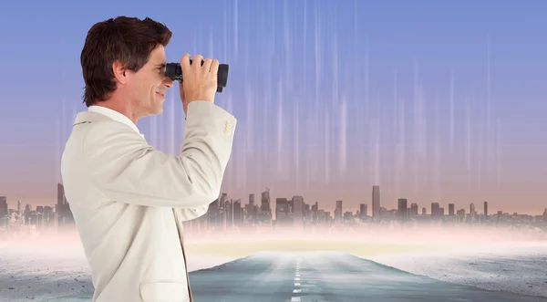 Businessman using binoculars — Stock Photo, Image