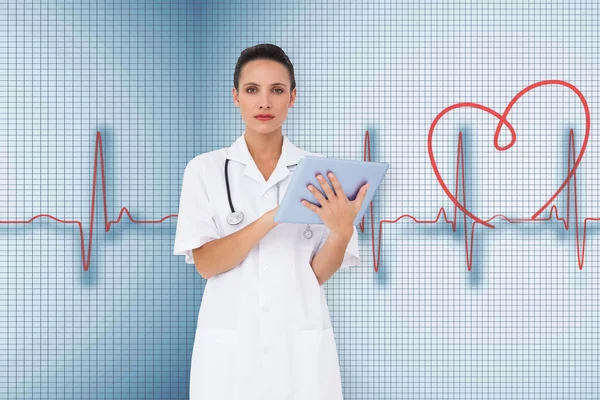 Pretty nurse using tablet pc — Stock Photo, Image