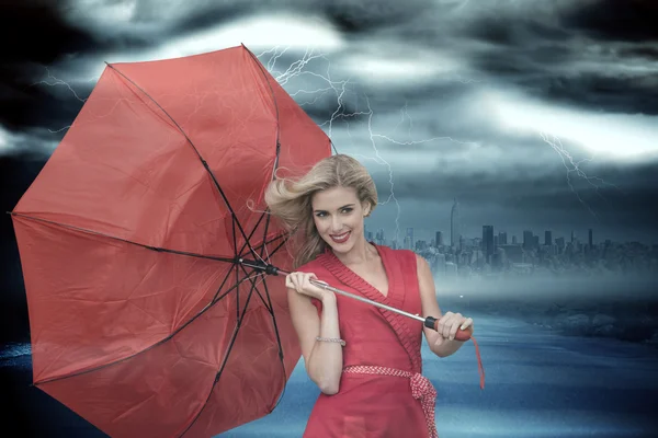 Blonde holding umbrella — Stock Photo, Image