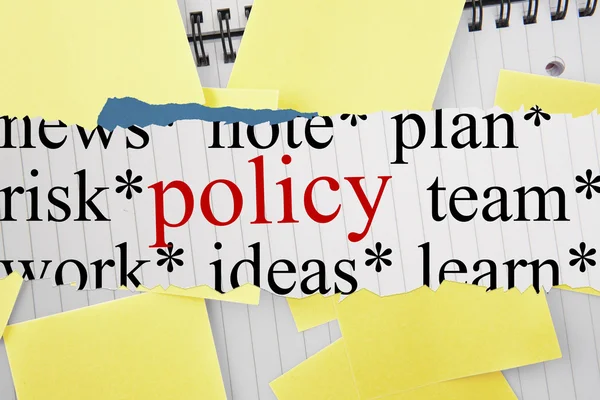 Policy against sticky notes strewn over notepad — Stock Photo, Image