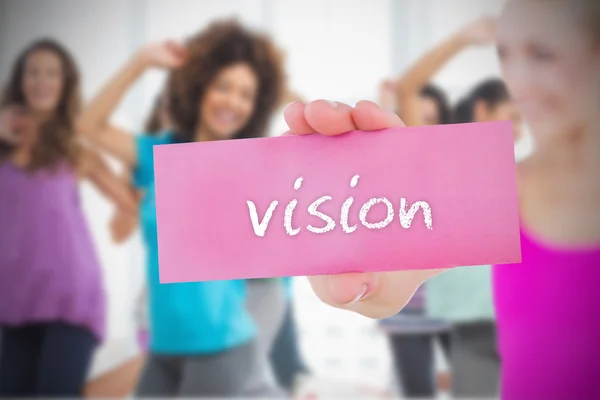 Woman holding pink card saying vision — Stock Photo, Image