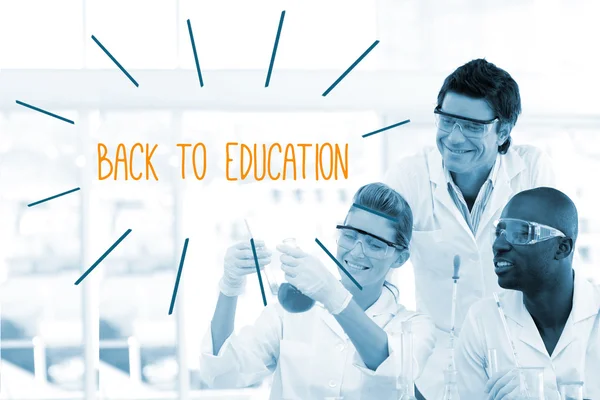 Back to education against scientists working in laboratory — Stock Photo, Image