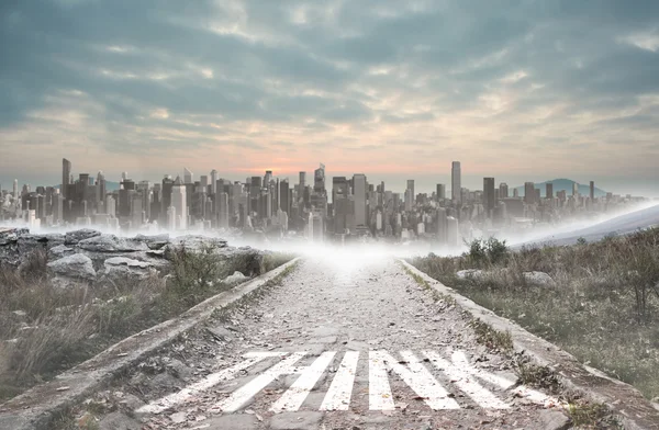 Think against stony path leading to large city on the horizon — Stock Photo, Image