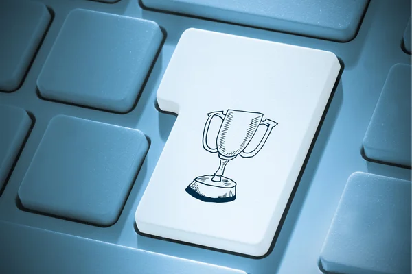 Composite image of winners cup on enter key — Stock Photo, Image