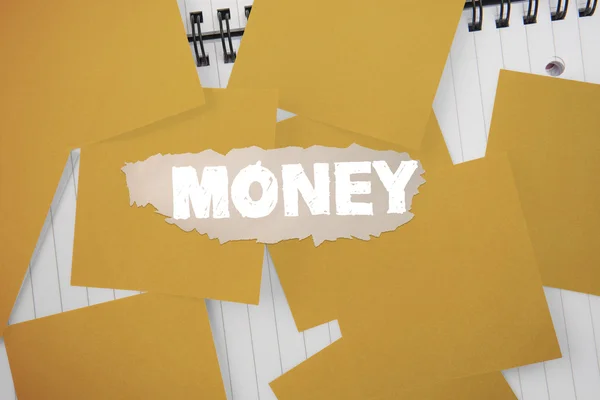 Geld tegen geel papier bezaaid over Kladblok — Stockfoto