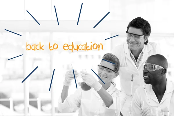 Back to education against scientists working in laboratory — Stock Photo, Image