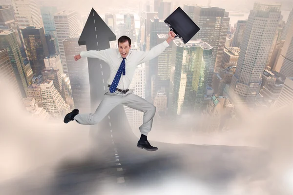 Jumping businessman with his suitcase — Stock Photo, Image