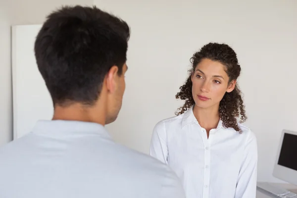 Casual business partners looking at each other — Stock Photo, Image