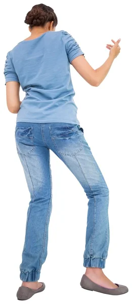 Brunette playing air guitar — Stock Photo, Image