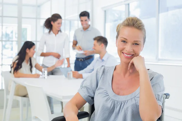 Businesswoman with team behind her — Stock Photo, Image