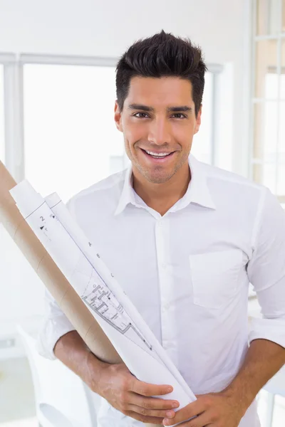Casual handsome architect holding blueprint — Stock Photo, Image
