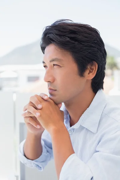 Thinking man with hands together — Stock Photo, Image