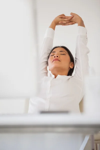 Casual businesswoman napping at her desk — Stock Photo, Image