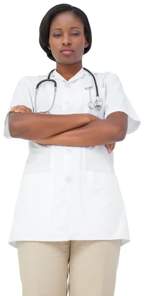 Verpleegkundige in tuniek met gekruiste armen — Stockfoto