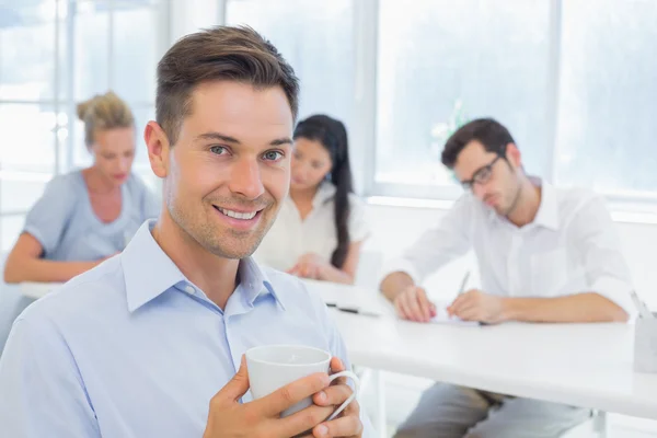 Empresário durante reunião — Fotografia de Stock